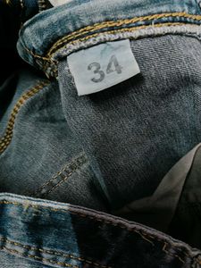 Distressed Blue Denim Jeans