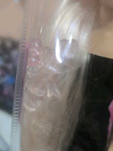 Hannah doll in black dress with long hair.