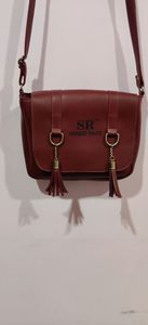 Adjustable sling handbag
