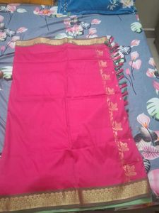 Elegant Pink Saree with Golden Details
