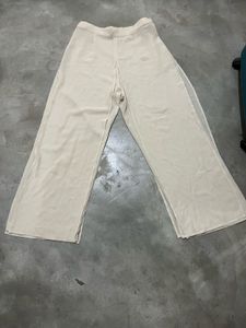 Beige Wide-Leg Sheer Overlay Trousers.