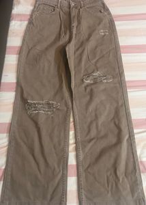 faded brown rugged jeans