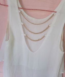 Styling White Top With Golden Back Chains