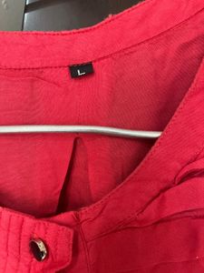Red Top With Black Button In Front