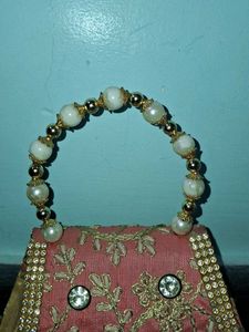 Elegant Pearl Handle Clutch