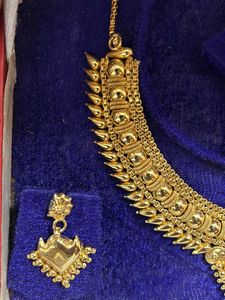 Artificia Gold Necklace And Earrings