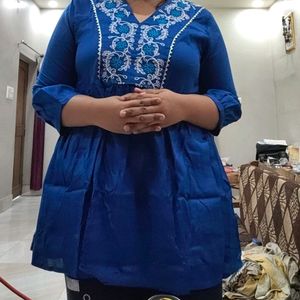 The Size Is XXI This Vibrant Colour Short Kurti .