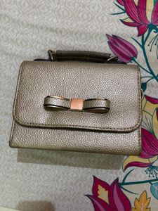 Gold Handbag with Bow Detail