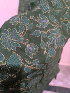 Green floral print kurti with golden detailing
