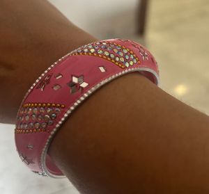 combo of wooden, golden and designer bangles