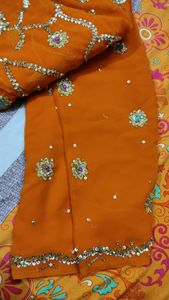 embroidered heavy orange saree