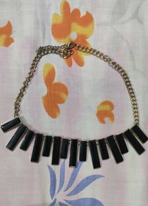 Black and gold neck piece