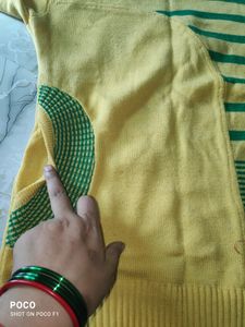 pretty yellow sweter with side pocket.