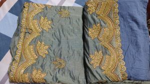 Elegant Green Silk Saree with Heavy Golden Embroid