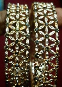 Gold floral bangles