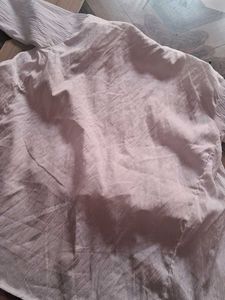 Its A White Top Wear With Multicolor Embroidery