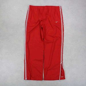 NIKE PARACHUTE BAGGY TRACKS.