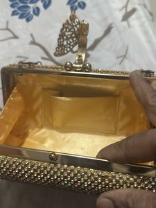 Elegant Gold Clutch with Chain