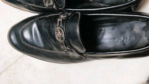 Gucci Shoes And A Pair Of Sports Shoe