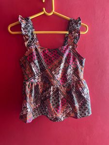 peplum sleeveless top