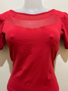 top features a V-shaped strap design at the back