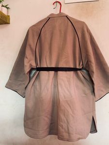 Elegant Beige Coat with Black Trim