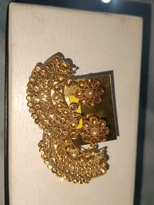 Gold tone earrings with pearl