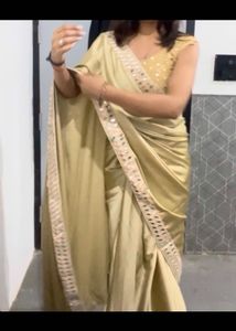 Elegant Beige Embellished Saree
