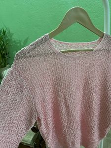 pink open-knit sweater