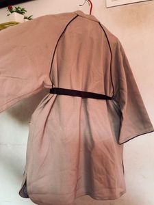 Elegant Beige Coat with Black Trim