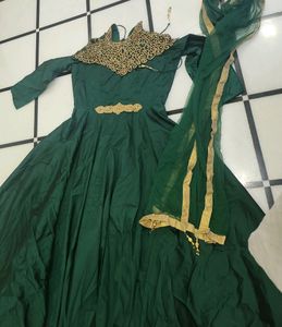 Luxurious Silk Dark Green Gown With Golden Stone