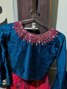 a blue and Rani colour choli lehenga with odni