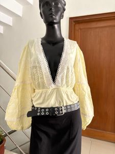 Yellow long sleeve bodysuit