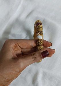 Gold-tone Bangle.