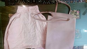 Denim jacket with pink bag