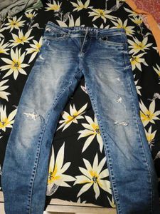 Distressed Blue Denim Jeans