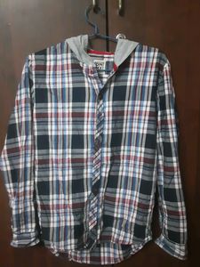 Stylish boys' plaid shirt with an attached hoodie.