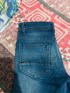 Distressed Blue Denim Jeans
