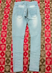 Light Blue Jeans With Criss Cross Design