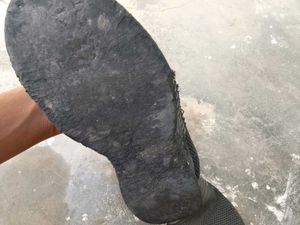 Worn Black Sneakers