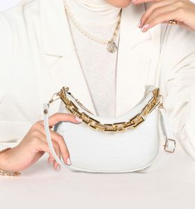 White shoulder bag with gold chain