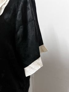 Black Shirt With White Lace Collar