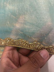 Elegant Teal Saree with Gold Details