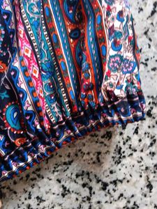 Patterned top traditional goes with black skirt
