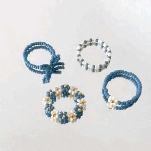 Set Of Four Beaded Flower Rings