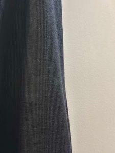 Black Sleeveless Bodycon With Buttons On It