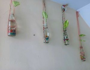 Hanging Glass Bottle Planter With Plant