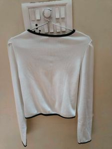A white cut-out long sleeve crop top