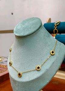 Gold Chain Necklace Featuring black bead or onyx