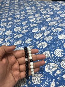 pair of two batcelets black and white